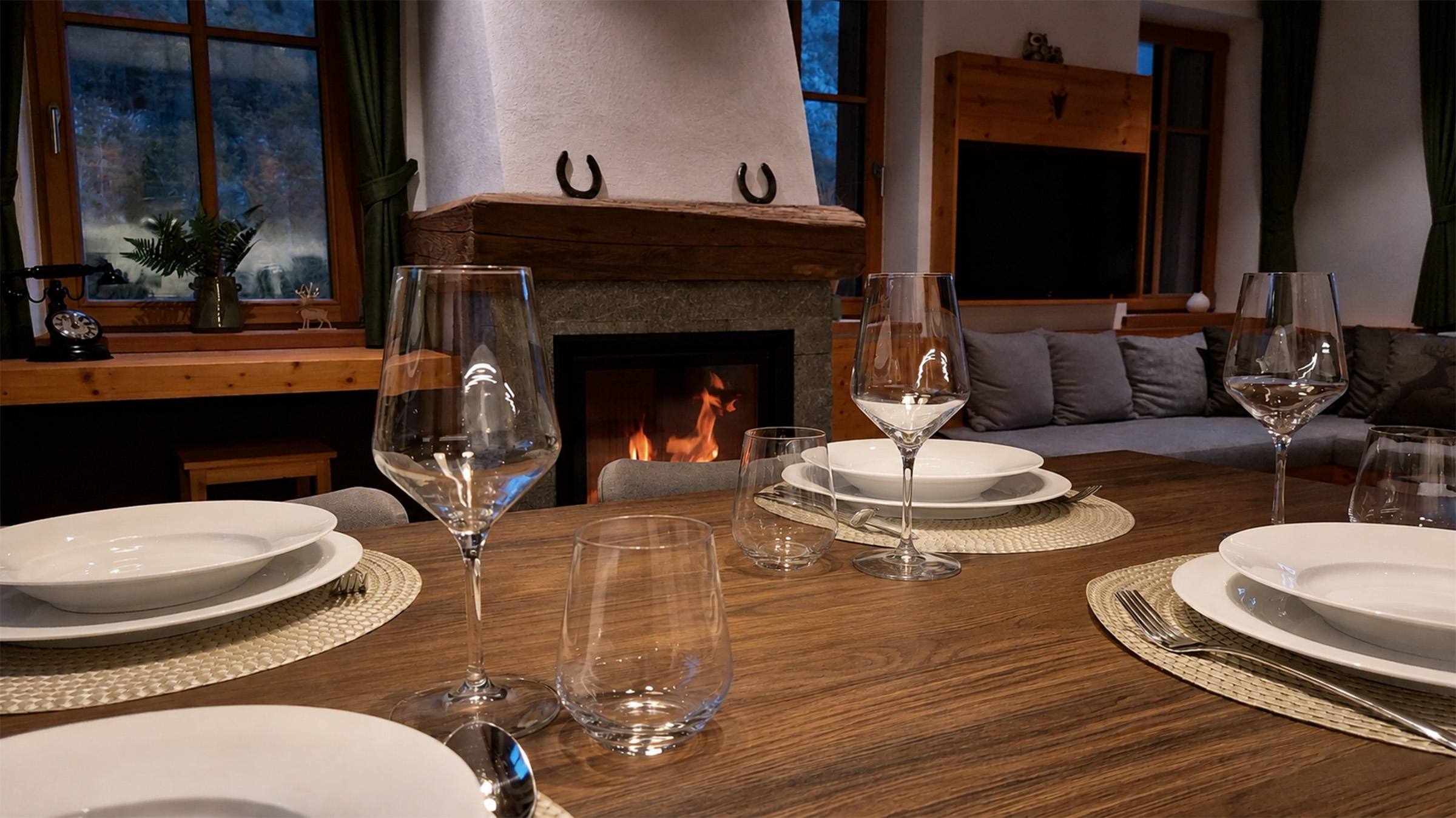 Living room with fireplace in the Alpine SPA Chalet by Lake Bohinj.