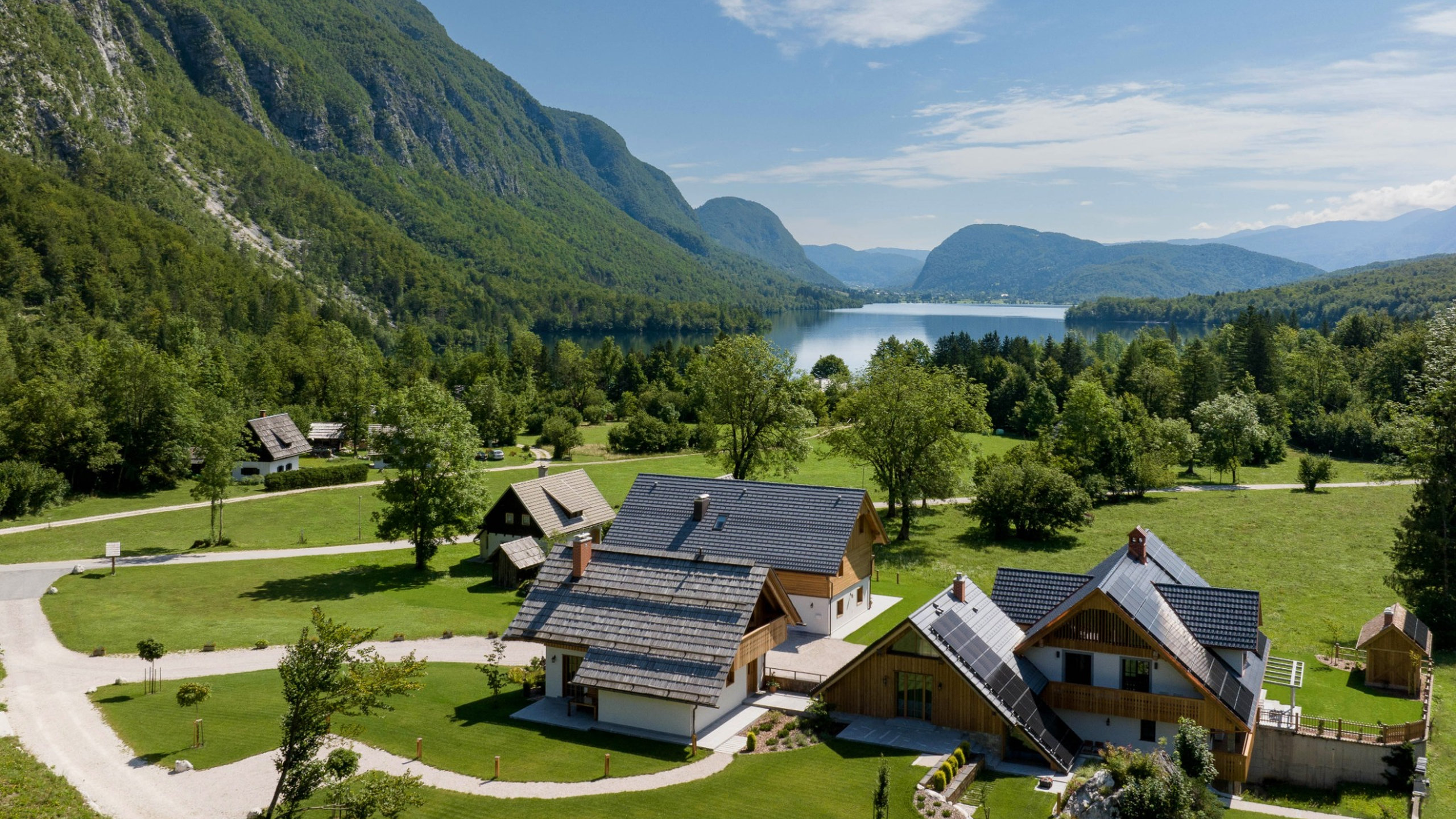 Aerial view of Privillage Stare – B&B, Villa and Chalet Resort by Lake Bohinj in Triglav National Park, Slovenia.
